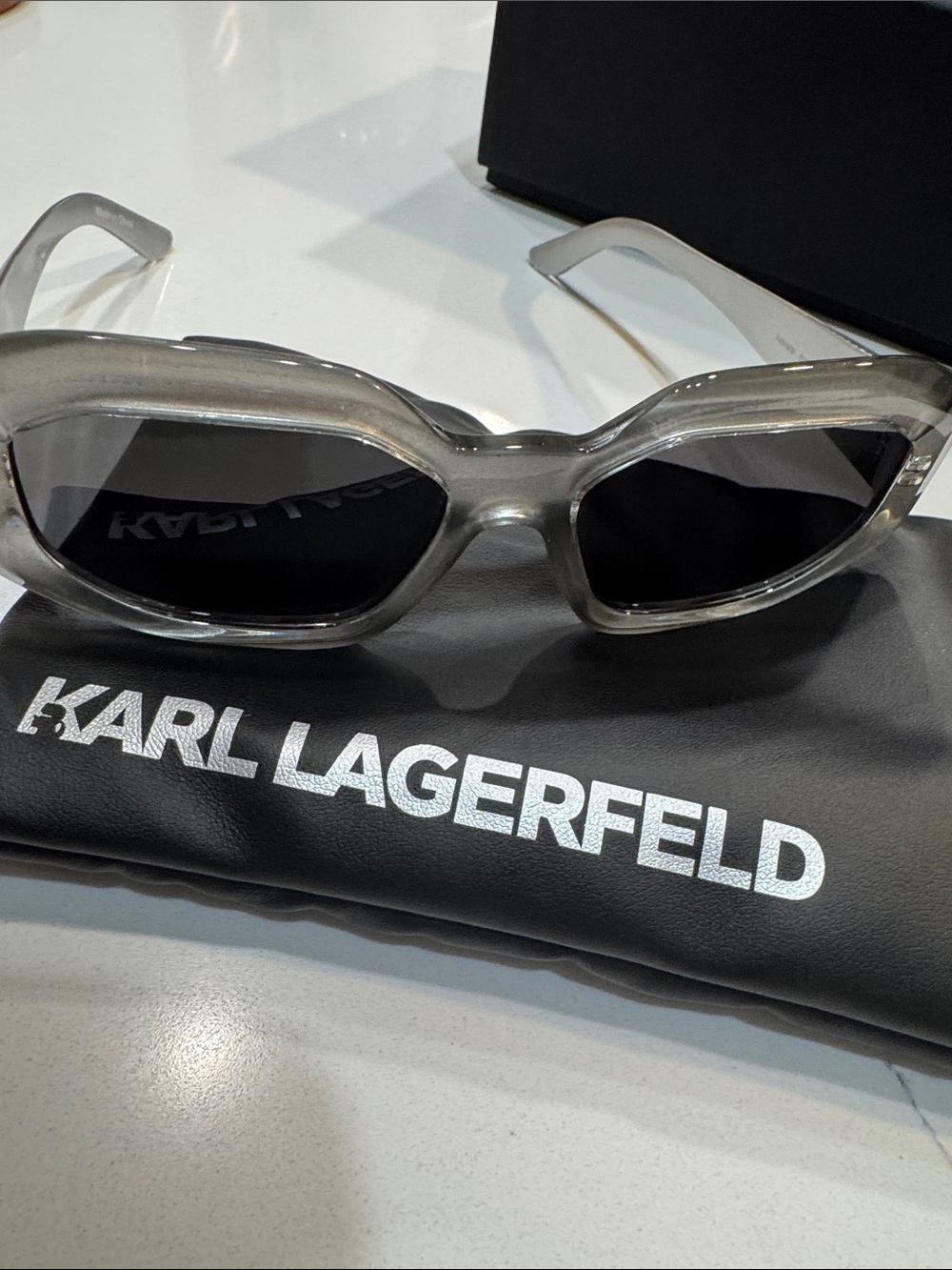 Karl Lagerfeld Transparent Gray Frame Sunglasses with Dark Lenses